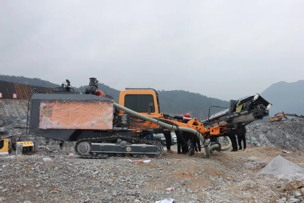 DTH drilling rig operating at a remote mountainous site
